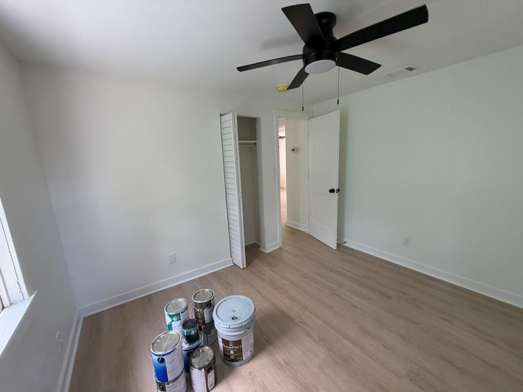 Interior repaint in progress during an Alvis Renovations property rehab