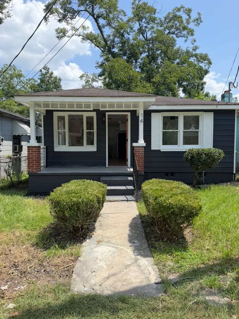 Wide view of the renovated cottage front elevation and walkway