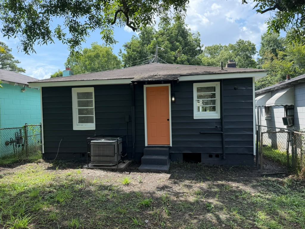 Rear exterior after siding paint, new steps and door replacement