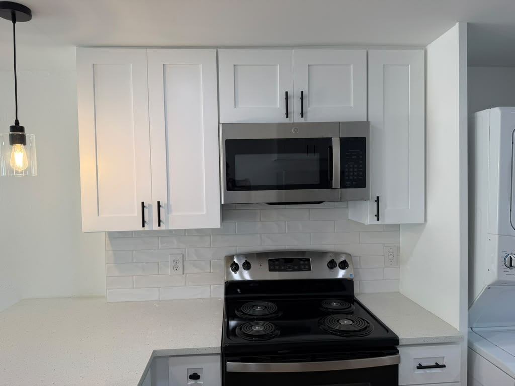 New shaker upper cabinets, subway tile backsplash and stainless range