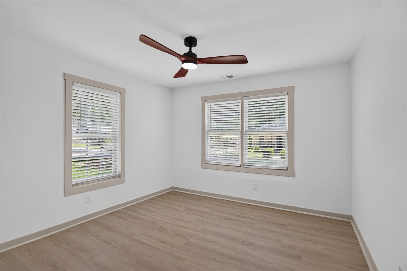 Rental bedroom turned over with fresh paint, new flooring and new trim