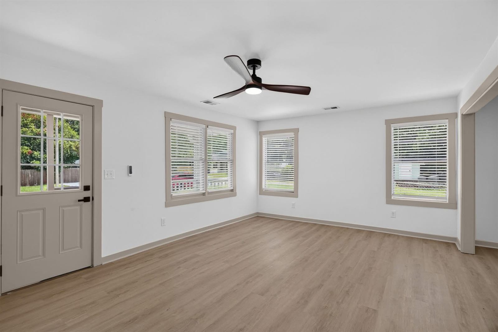 Living room made ready for listing with new flooring, paint and blinds